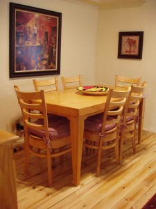 A joyful place to eat. Solid wood dining table seats 4.